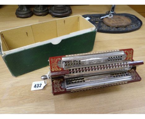 HARMONICA by M Hohner and with 6-branches in original box.