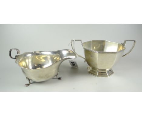 SILVER twin-handled octagonal sucrier together with silver sauce-boat raised on three paw type feet, 7 troy oz approximately 
