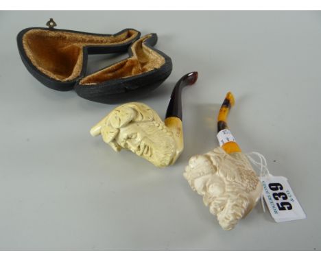 MEERSCHAUM PIPE in the form of a bearded man, together with another gentleman's smoking pipe in fitted case (2).