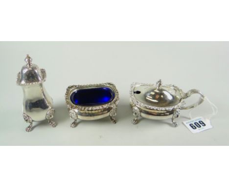 A THREE PIECE EPNS CONDIMENT SET comprising lidded mustard pot, matching salt basin and matching pepeprette each with lion he