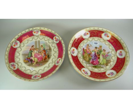 A PAIR OF AUSTRIAN PORCELAIN CHARGER DISHES, typically decorated with centred classical panels in transfer and with floral pa