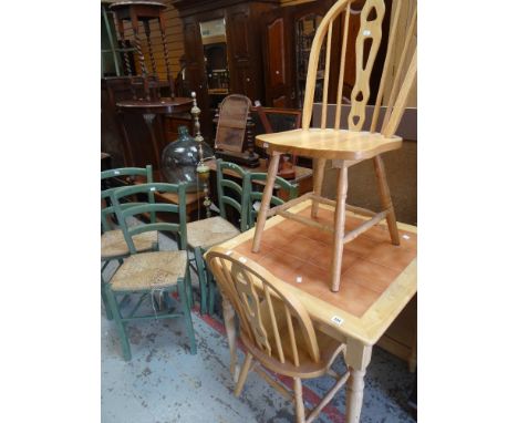 A MODERN LIGHT WOOD TILED TOP KITCHEN TABLE with two matching chairs, together with a set of four modern rush-seated kitchen 