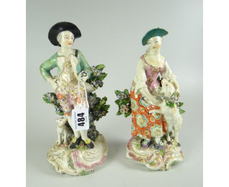 A PAIR OF DERBY PORCELAIN FIGURES modelled as a shepherd and shepherdess, the female with lamb, the male with dog, 20cms high