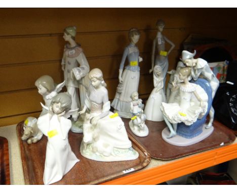 COLLECTION OF NAO & LLADRO FIGURESOne of the angels heads has been restored.It looks like something has broken of the hand of