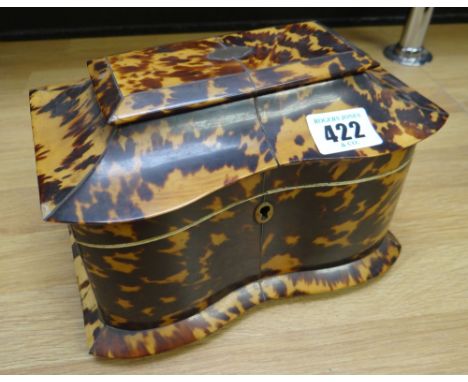 A REGENCY TORTOISESHELL SERPENTINE TEA CADDY on original four-corner bun feet, the hinging lid revealing twin compartments wi