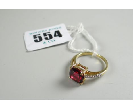 DIAMOND RING being an 18-carat yellow gold ruby and diamond chip ring in box, 3.7 grams approximately.