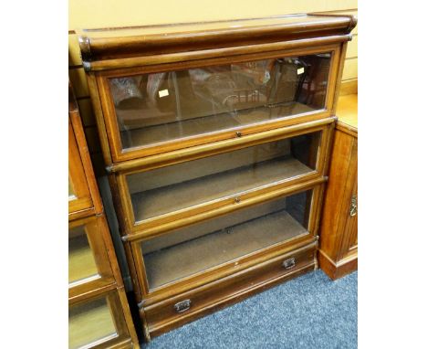 C20TH GLOBE WERNICKE-TYPE SECTIONAL BOOKCASE having three glazed compartments above drawer, 114 cms high x 87 cms wide x 27 c