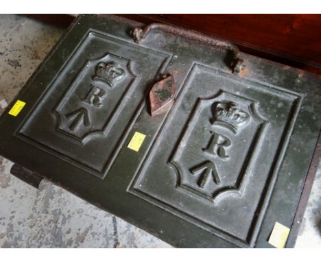 A HEAVY VINTAGE CAST-IRON STRONGBOX with key and carry-handles, with embossed Royal cypher to lid