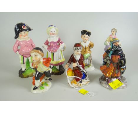 A GROUP OF SEVEN MINIATURE FIGURES including pair of nineteenth century pink lustre decorated Commedia De L'arte, pair of Cap