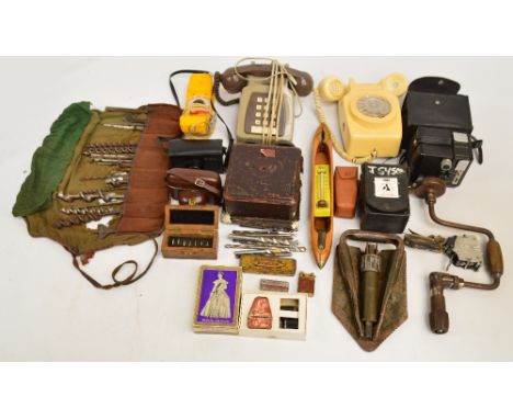 A group of collectors' items including three vintage telephones, a circular 1950s Coronet Ambassador box camera, a Kodak Inst