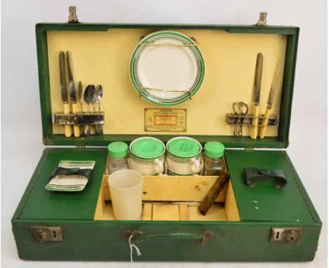 A Sirram green picnic suitcase with tea and lunch outfit for four persons.