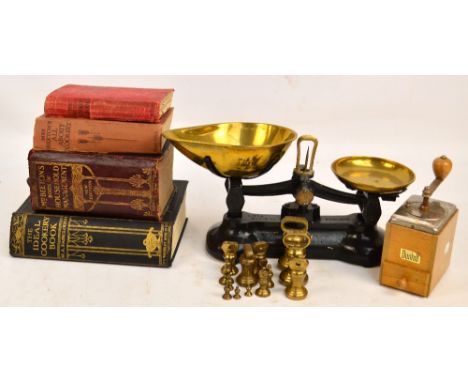 A set of Libra Scale Company brass and iron kitchen scales, a group of weights, four cookery books to include three Mrs Beeto