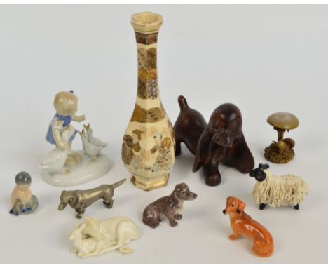 A collection of mixed ceramics including a Royal Doulton dachshund figure, a Dahl Jenson dachshund figure, a Royal Copenhagen