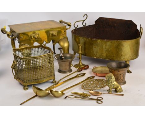 A 19th century brass footman, a brass oval jardiniere, a brass ladle, trivet, pestle and mortar, ejector candlestick, etc.