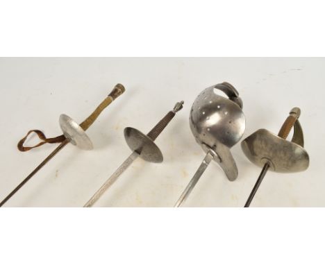 A 19th century Wilkinson fencing sword, a further example with pierced knuckle guard and two later fencing foils (4).