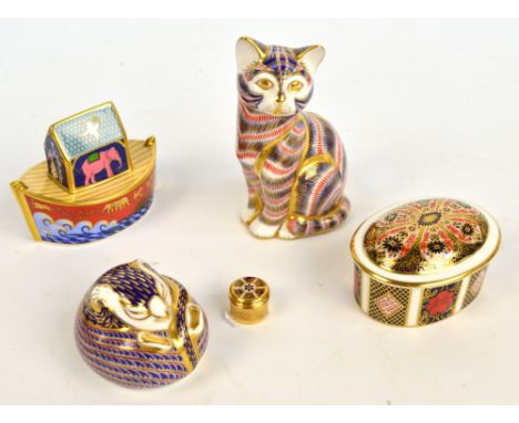 A collection of Royal Crown Derby items; a dormouse paperweight with silver stopper, a cat figure with silver stopper, a Noah