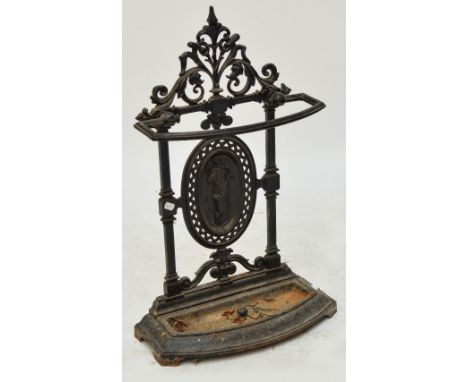 An early 20th century cast iron stick/umbrella stand, height 77cm. CONDITION REPORT: Rust and paint loss throughout, tarnish 