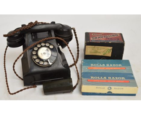 A quantity of collectors' items comprising a vintage black bakelite phone with contacts drawer beneath, an "Addiator" (early 