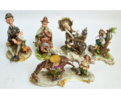 Five Capodimonte figures depicting Don Quixote and Sancho Panza, a man playing a flute, a man playing a barrel organ, a boy s