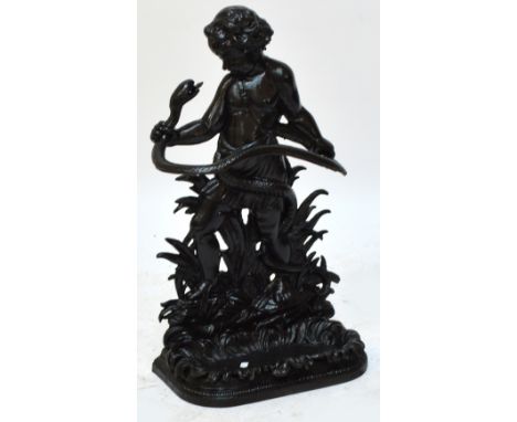 A decorative cast iron stick stand modelled as a young boy wrestling a snake, height 82cm.