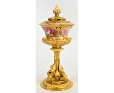 An early 20th century Royal Worcester gilt heightened blush ivory pot pourri vase and cover, the urn shaped top raised on gri