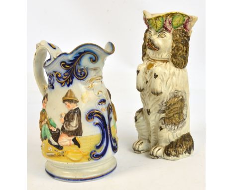 A mid 19th century Staffordshire relief moulded jug decorated to both sides with children playing cards (lip restored), and a