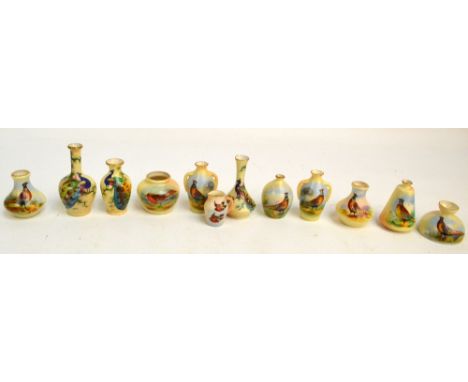 A collection of Locke & Co Worcester blush ivory miniature vessels of various shapes and sizes, painted with birds including 