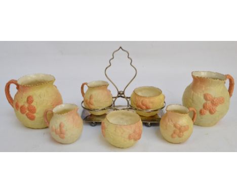 A collection of Locke & Co Worcester blush ivory ceramics with a moulded design of hops and hop leaves, comprising a small ju