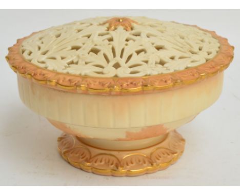 A large Locke & Co. Worcester blush ivory pot pourri bowl with reticulated cover with gilt heightened foliate decoration, sha