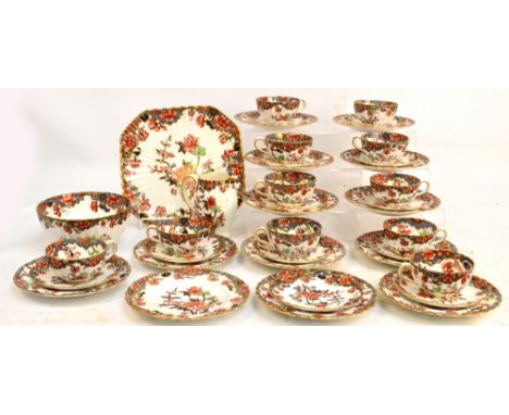 A Copelands china floral decorated tea service comprising bread and butter plate, bowl, jug, thirteen side plates, twelve sau