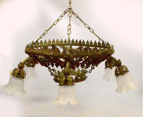 An Arts and Crafts painted metal ceiling light decorated with acorns and oak leaves set with six short scrolling frames suppo