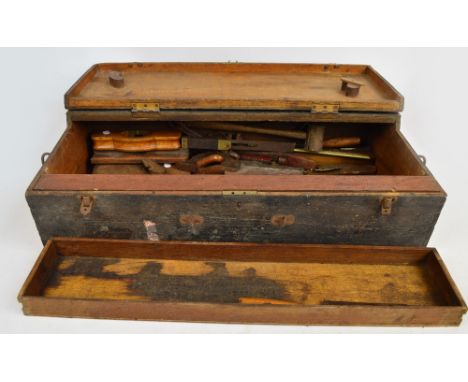 A painted pine toolbox with two pullout drawers containing woodworking and other tools including planes, chisels, wrenches, a
