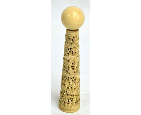 A late 19th century Chinese Canton ivory cup-and-ball game, the sectional conical stem overall carved with numerous figures i