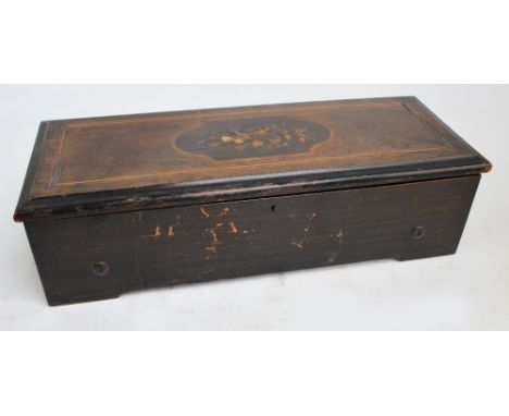 A late 19th/early 20th century musical box, the rosewood inlaid and simulated rosewood case enclosing a glass cover with 13" 