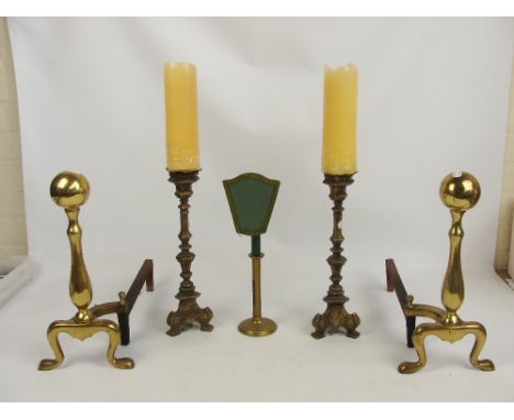 A pair of pricket candlesticks, brass ejector candlestick and a pair of fire dogs (5).