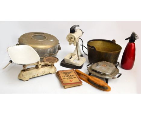 A large quantity of vintage kitchenalia to include a large pestle and mortar, a jam pan, a quantity of storage jars, etc.