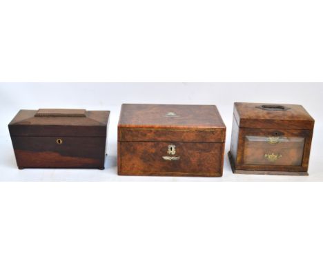 An early 20th century burr walnut vanity box with mother of pearl decoration and escutcheon, the hinged lid enclosing a secti