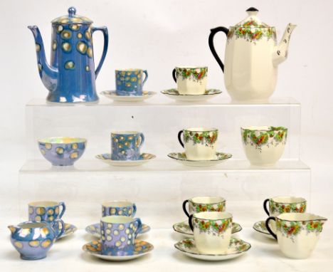 A Czechoslovakian six setting lustre glazed coffee set comprising six cups and saucers, a coffee pot, a cream jug, and a suga