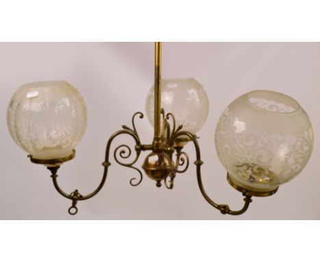 An early 20th century three branch pendant light fitting with scrolling arms and globular acid etched shades, height approx 8