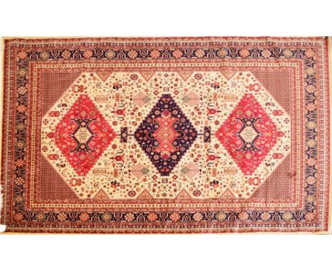 A beige ground Caucasian carpet, 280 x 200cm.