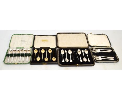 A set of six cased Elizabeth II hallmarked silver gilt coffee spoons with green guilloche enamel to the back of the bowls and
