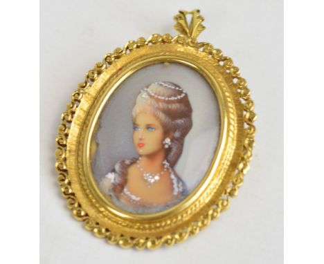 An 18ct yellow gold mounted miniature portrait brooch/pendant depicting a young woman, her jewellery set with four tiny clear