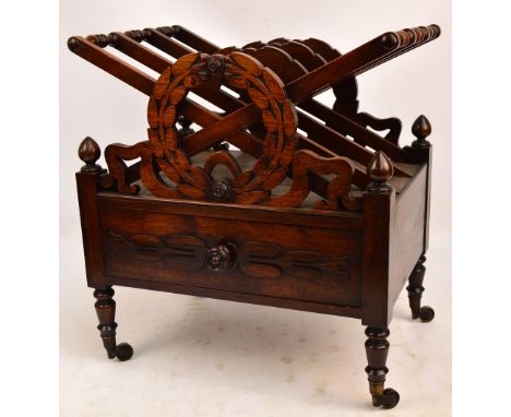 A William IV rosewood Canterbury designed by J.C. Lowdon, the X-framed divisions centred with laurel wreaths above single dra