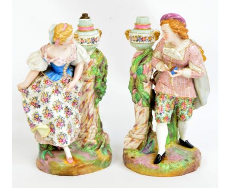 A pair of late 19th century Meissen male and female figural lamp bases, base inscribed "Exposition de Vienne (Autriche) 1873"