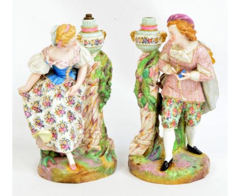 A pair of late 19th century Meissen male and female figural lamp bases, base inscribed "Exposition de Vienne (Autriche) 1873"