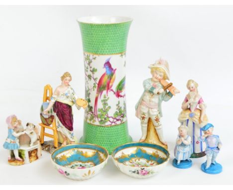 A small collection of Continental porcelain including variously sized figures, a pair of French gilt heightened rose painted 