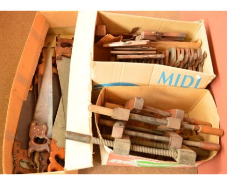 A large quantity of vintage woodworking tools including various sized wood planes including an example by Thomas Ibbotson, Su