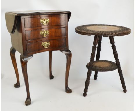 An early 20th century Anglo-Indian teak two tiered occasional table with foliate carving and carved tripod base, height 53cm,