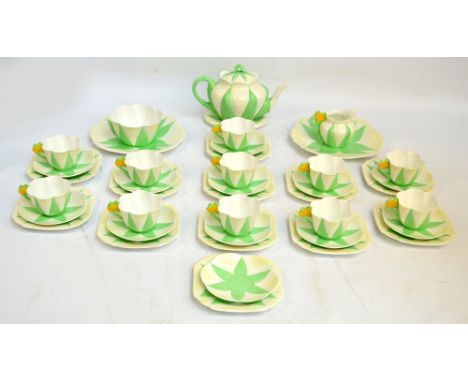 ***PLEASE NOTE: Amended condition report*** An extensive Shelley tea service in green and white star and fan pattern 11993/9,