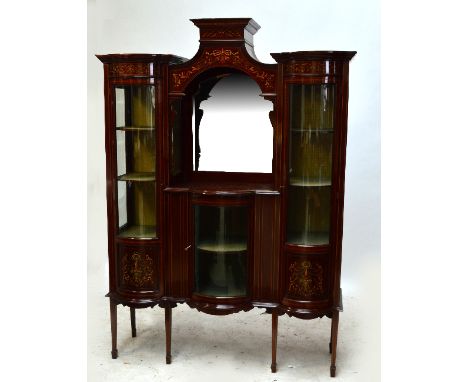 An Art Nouveau mahogany crossbanded and line inlaid display cabinet with central mirrored recess above single bowed glazed do